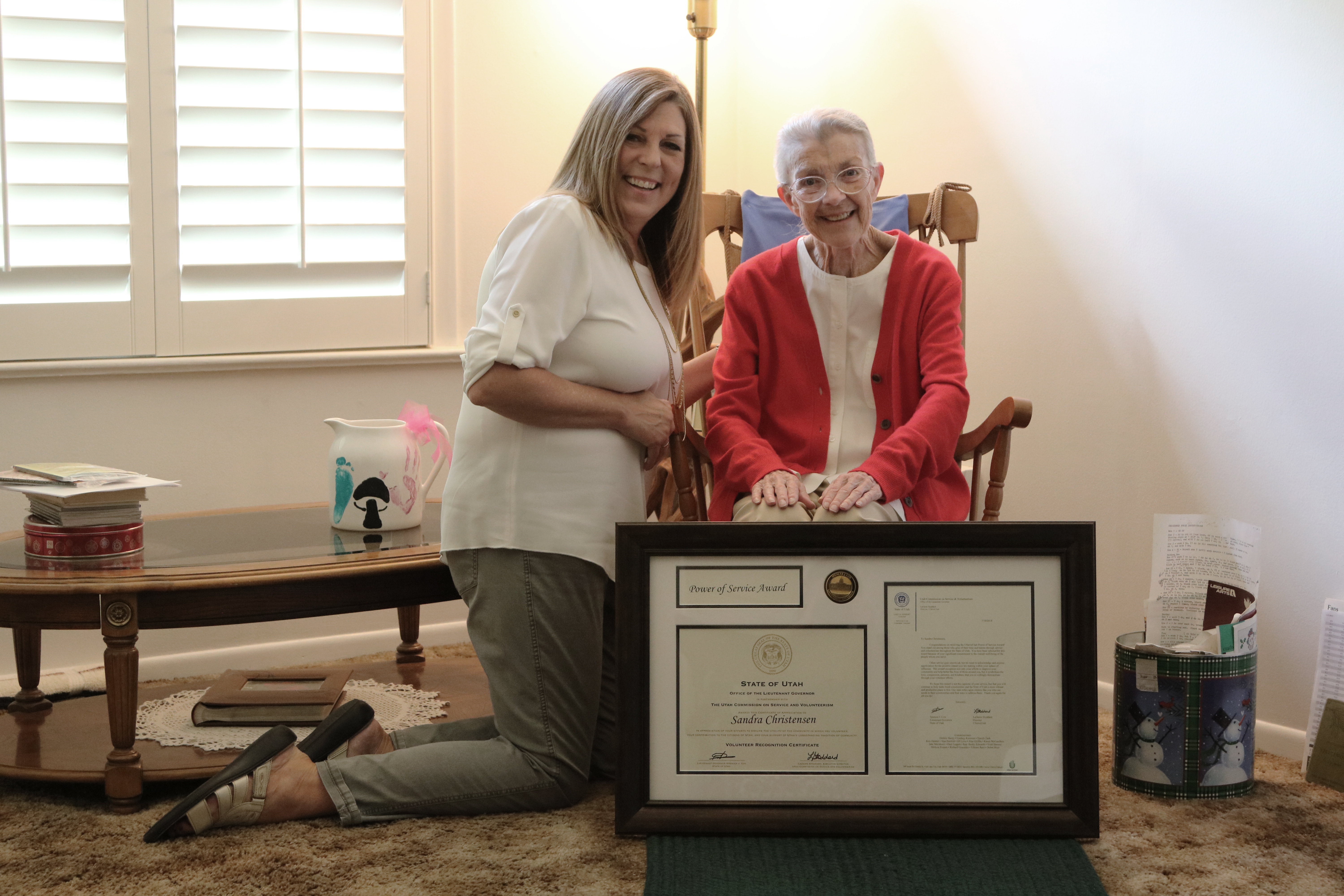 LaDawn Stoddard (left) presenting Sandra Christensen with the Power of Service Award on July 17, 2018