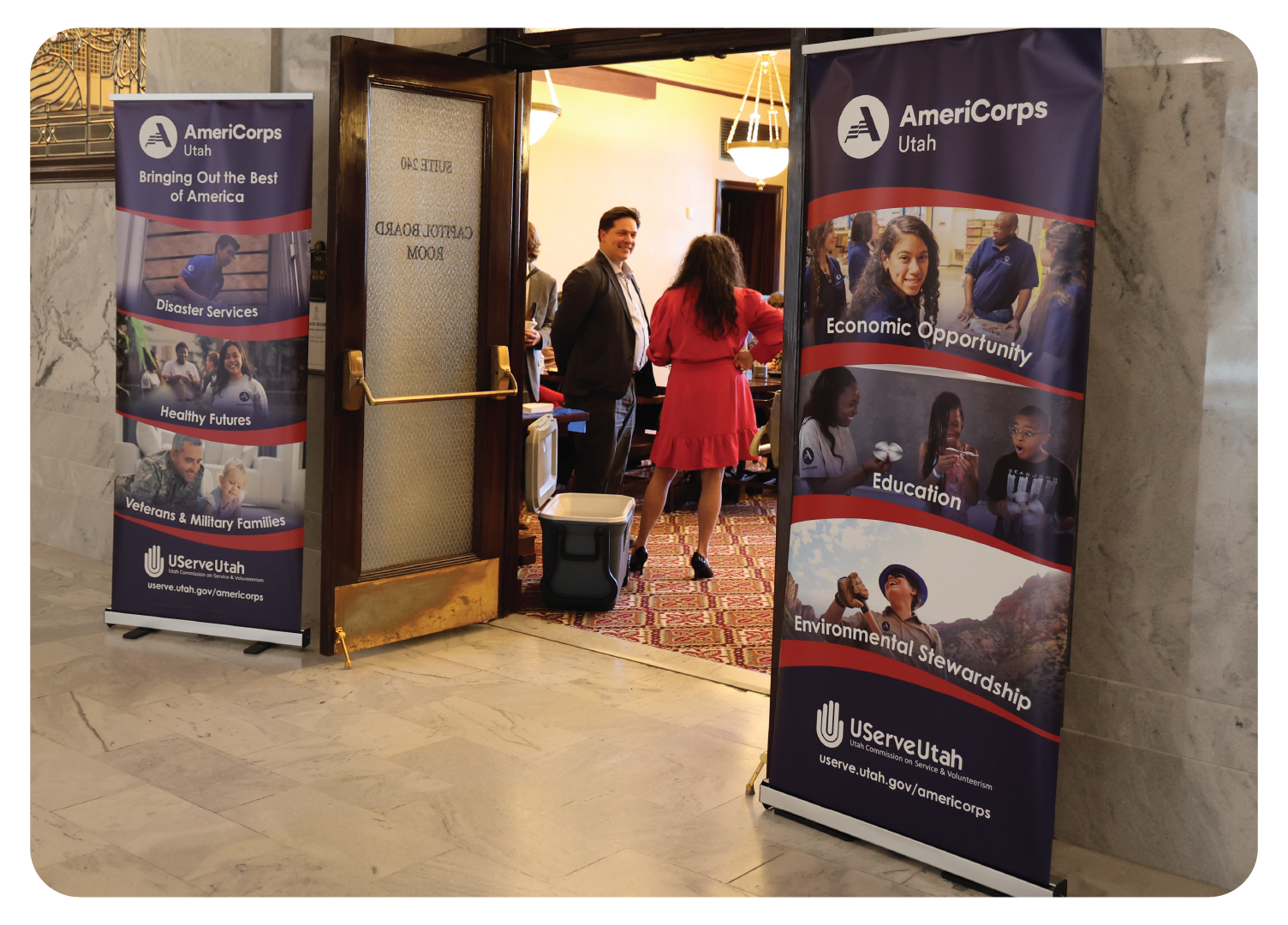 Entrance of Utah State Capitol Board room with AmeriCorps stand-up banners outside doors.