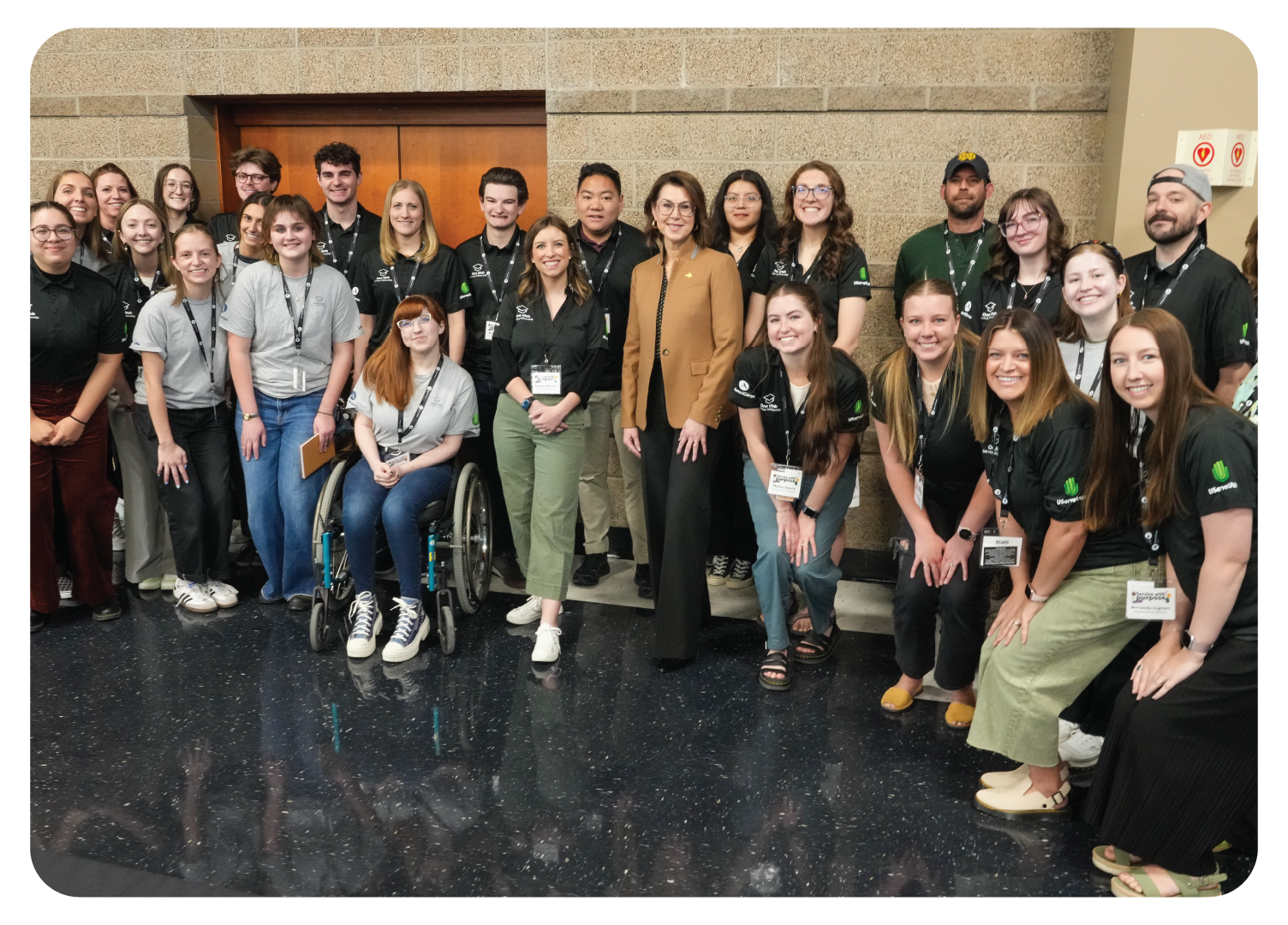 Group of AmeriCorps members posing for group photo with Lt. Governor Henderson at AmeriCorps Utah Member Gathering