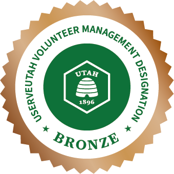 Bronze badge for UServeUtah Volunteer Management Designation with Utah emblem.