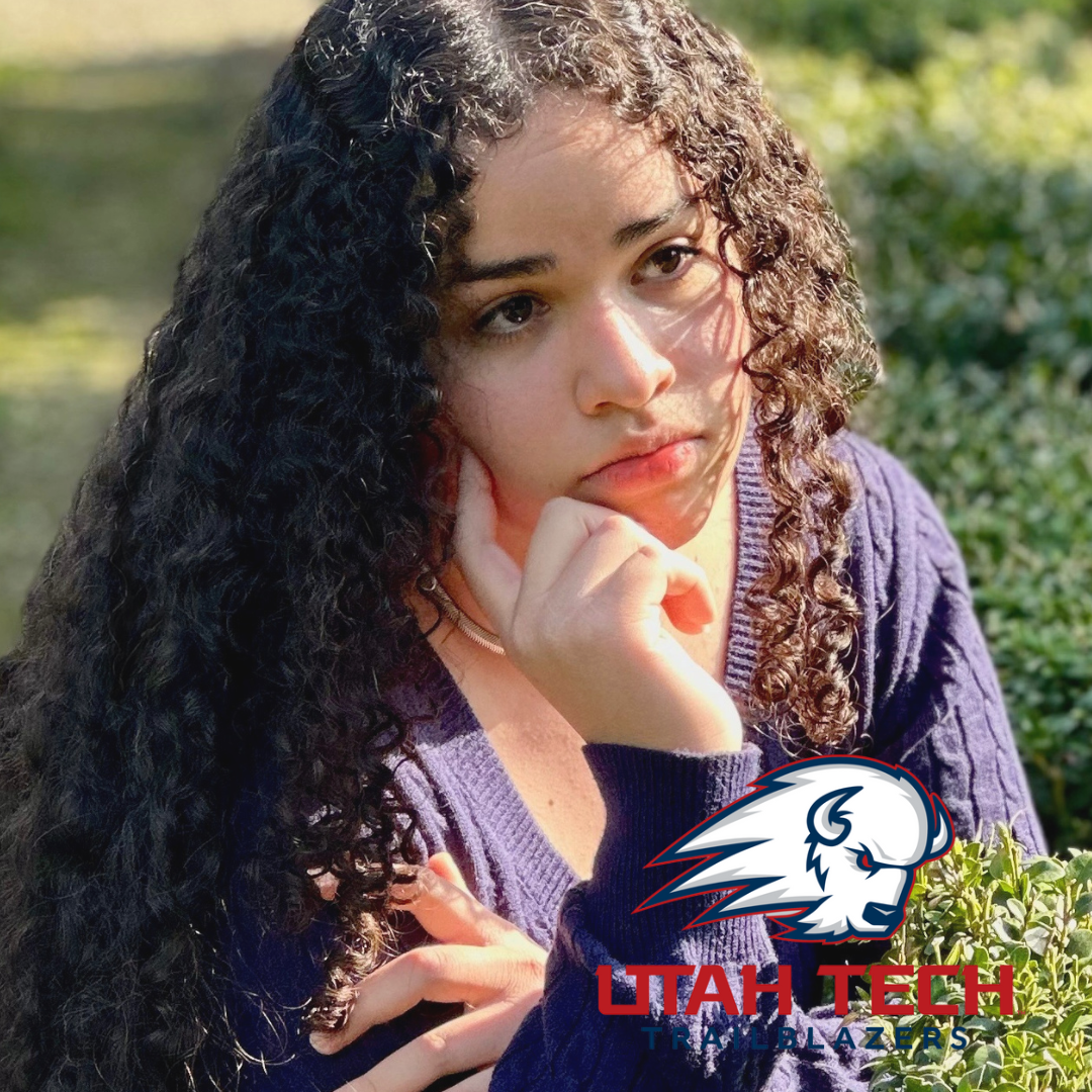 CCEC member Jade Ventura a young woman smiling in a garden wearing a colorful off-shoulder top with intricate patterns. Includes University of Utah's "U" icon.