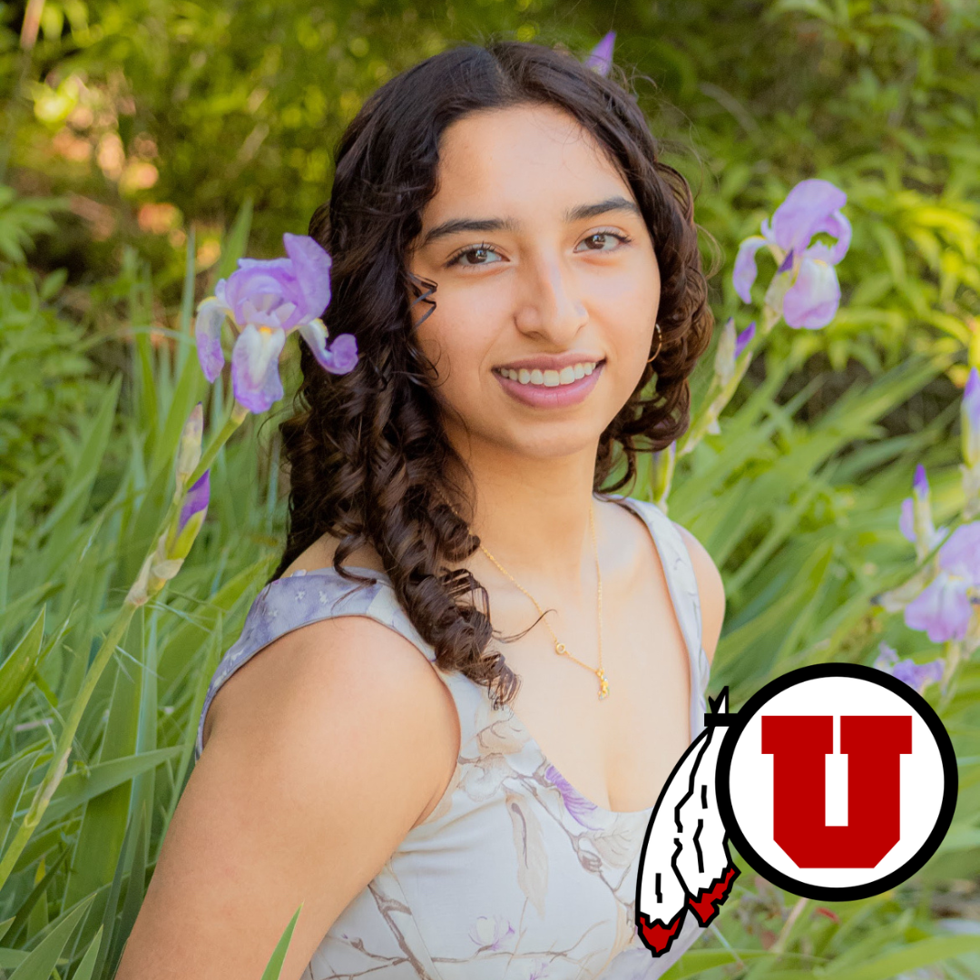 CCEC member Carlos Diaz, a young man with curly hair and wide smile in a dark purple blazer. Includes Utah State University's "U State" icon.